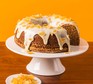 Ginger & white chocolate cake served on a cake stand