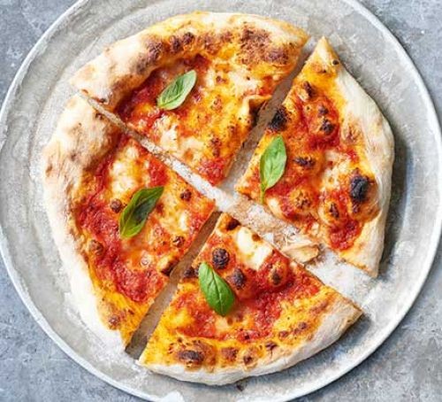 Margherita pizza divided into four quarters