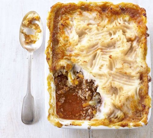 Shepherd's pie in a square dish with a spoon