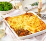 Ox cheek cottage pie with buttery mash topping in a large baking dish