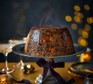 Pressure-cooked citrus Christmas pudding on a cake stand