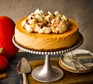 Pumpkin cheesecake on a cake stand