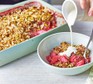 Gluten-free rhubarb & strawberry crumble in a baking dish and bowl