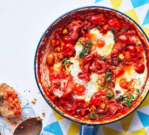 Baked eggs with beans in pan