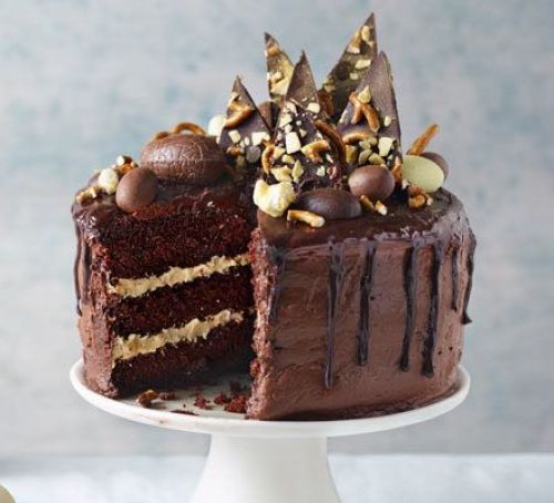 Chocolate cake topped with chocolate shards and eggs